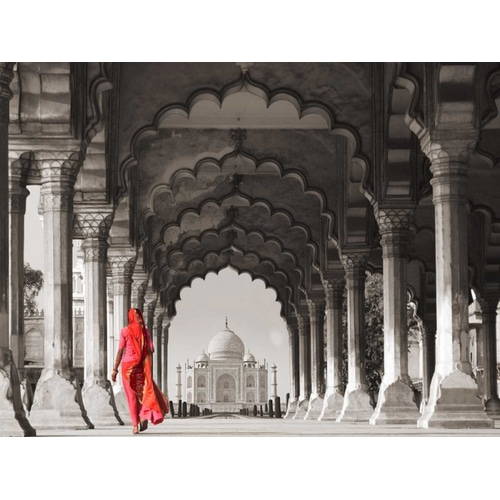 Woman in traditional Sari walking towards Taj Mahal