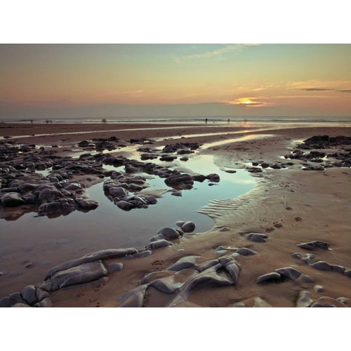 Rock pools on the beach at dusk