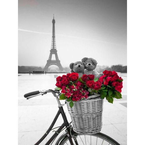 Teddy Bears and bunch of red roses on bicycle with Eiffel tower in the background