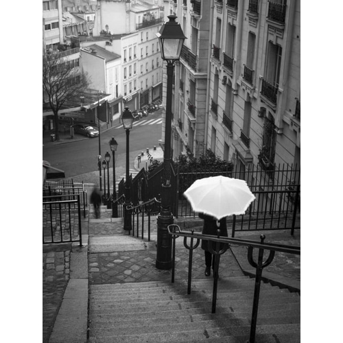 Woman with white umbrella standing on staircase in Montmartre, Paris, France