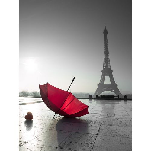 Two umbrellas next to the Eiffel tower