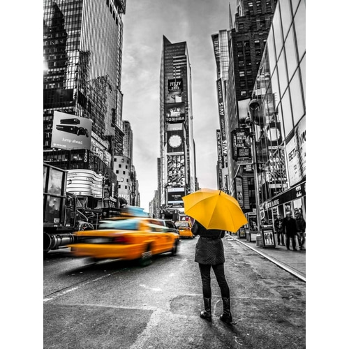 Man with yellow umbrella at Times square, New York