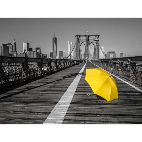 Yellow umbrella on pedestrian walkway on Brooklyn bridge, New York
