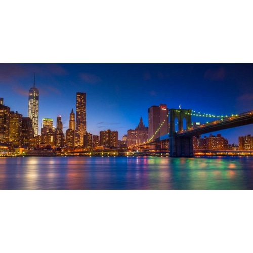 Evening shot of Lower Manhattan skyline and Brooklyn Bridge, New York