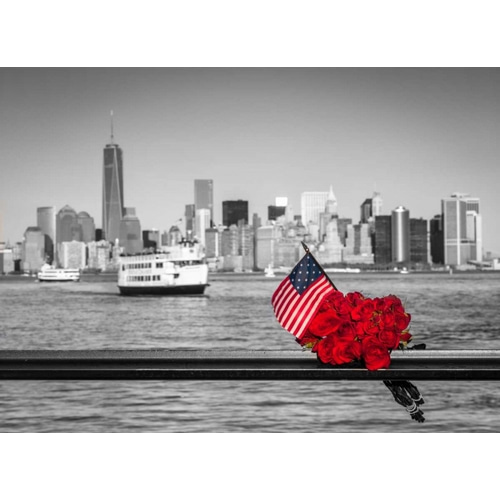 USA flag with bunch of roses on railing with Lower manhattan skyline in background, New York