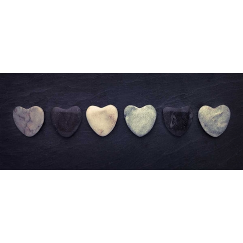 Heart shaped stones in a row