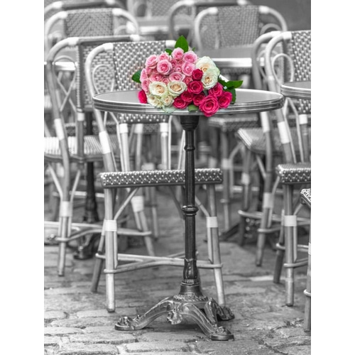 Bunch of Roses on street cafe table in Paris, France