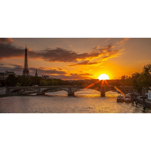 View of the Eiffel Tower with a bridge in the foreground during sunset, Paris, France