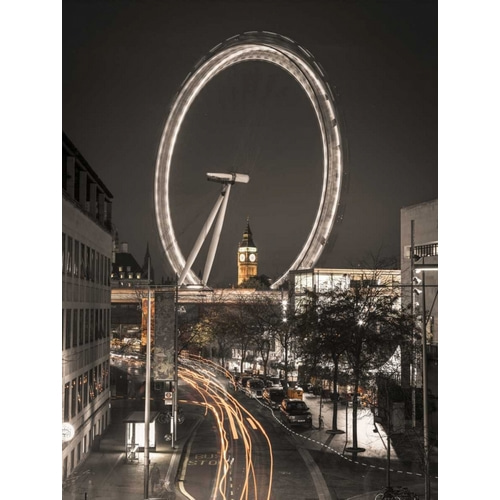 Night shot of London street with Millennium wheel in background