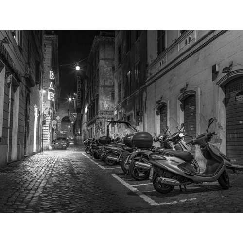 Vehicles parked on narrow city streets of Rome, Italy