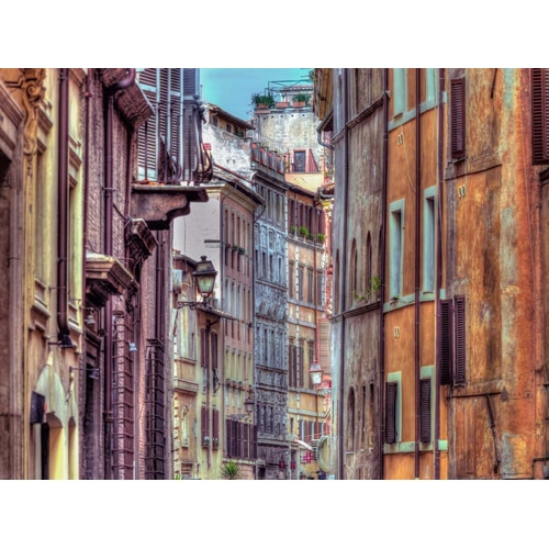 Narrow street through old buildings in Rome, Italy