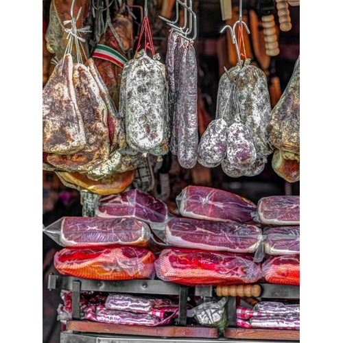 Various salami hanging in a window of an Italian Salami shop, Rome, Italy