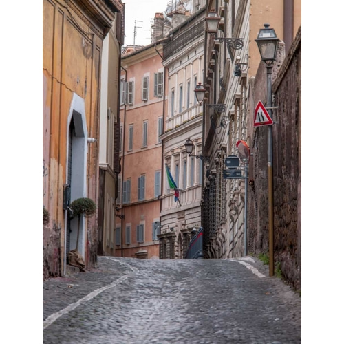 Narrow street through old buildings in Rome, Italy