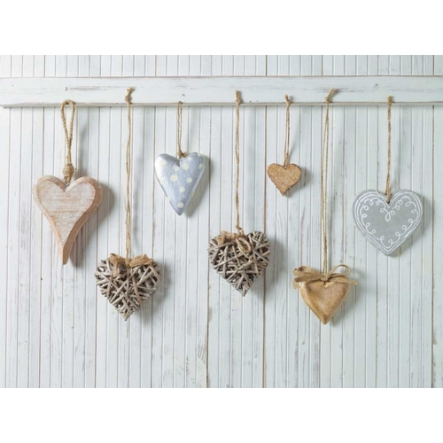 Hearts hanging on wooden background