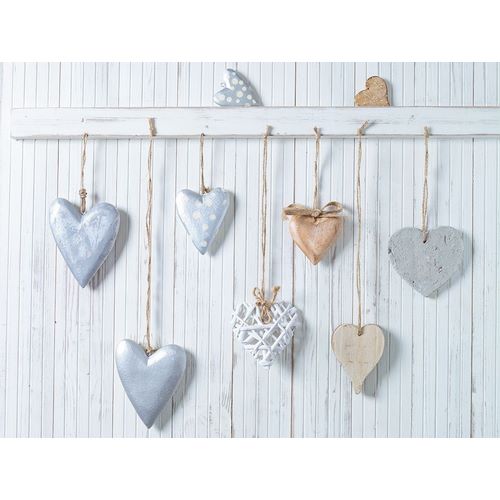 Hearts hanging on wooden background