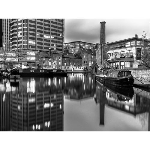Narrow canal with small boats in Birmingham, UK