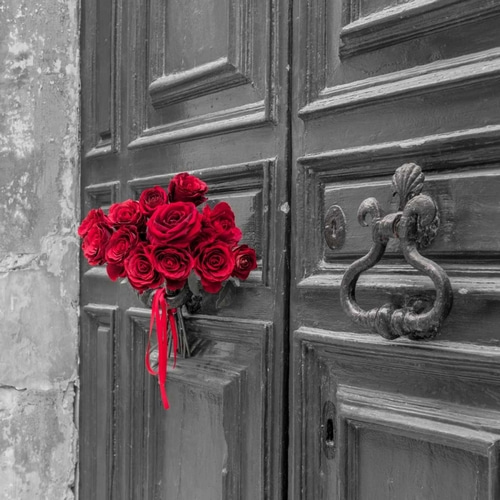Bunch of roses on door of a building in Mdina, Malta