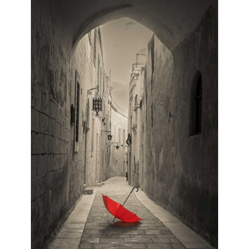 Red umbrella on narrow street of Mdina, Malta