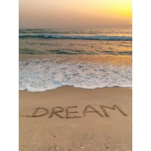 Sand writing - Word Dream written on beach