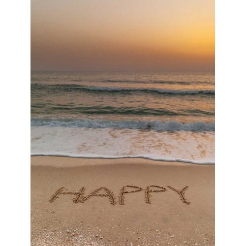 Sand writing - Word Happy written on beach