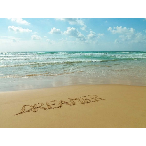 Word Dreamer written in sand on the beach
