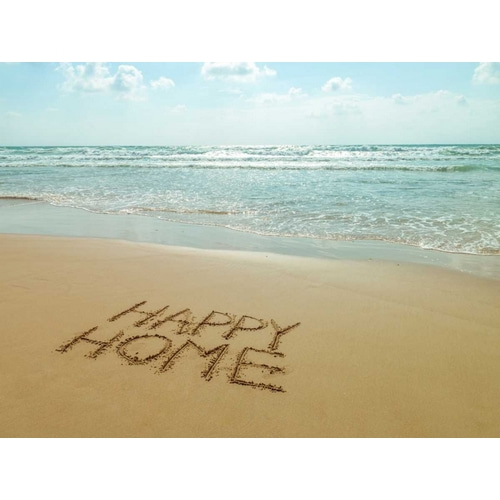 Happy Home written in sand on the beach