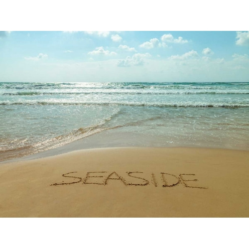 Word Seaside written in sand on the beach