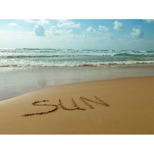 Word Sun written in sand on the beach