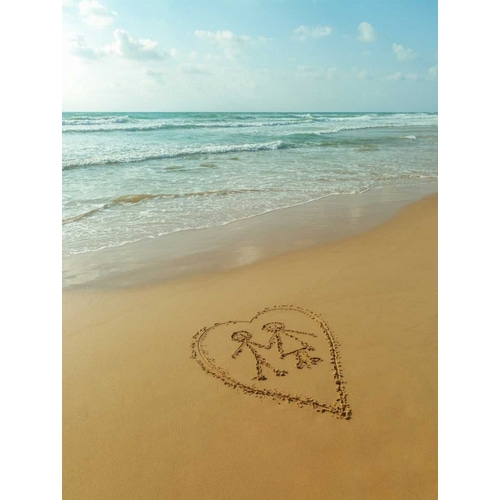 Couple in heart drawn on sand at the beach