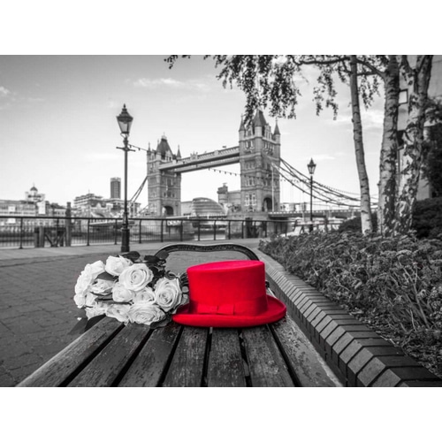 Red Hat with bunch of Roses on a bench near Tower Bridge, London, UK