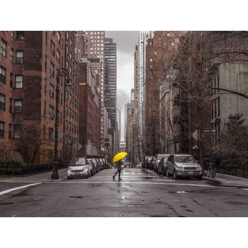 Tourist with yellow umbrella on street of Manhattan, New York