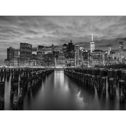 Manhattan skyline with rows of groynes in foreground, New York