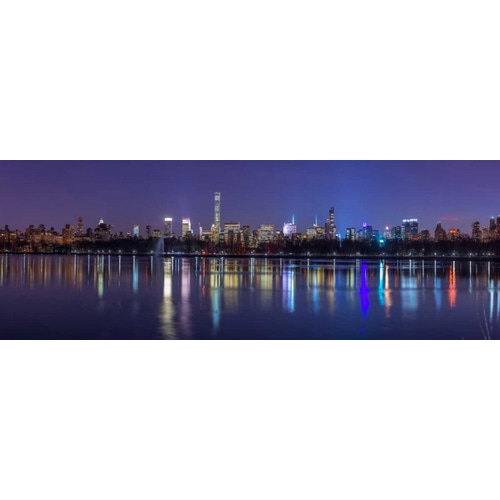 View of New York city skyline from Central park in evening