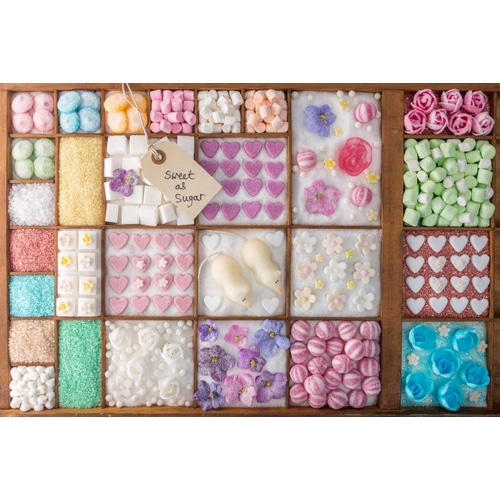 Mix of candies and sweets in wooden box