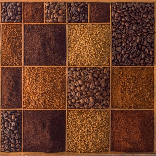 Variety of coffee beans in a wooden box