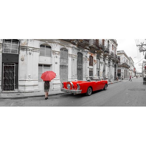 Woman with red umbrella by a vintage car on the street of Havana-Cuba
