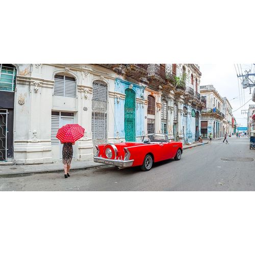 Woman with red umbrella by a vintage car on the street of Havana, Cuba, FTBR 1851