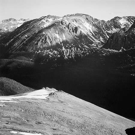 Panorama of barren mountains and shadowed valley, in Rocky Mountain National Park, Colorado, ca. 194