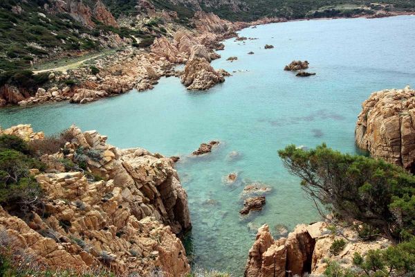 Rocky cliffs on turquoise sea in Sardinia Island