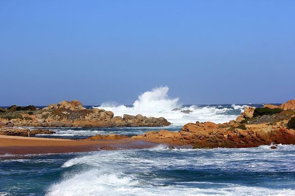 Stunning waves crashing on rock in sardinia island
