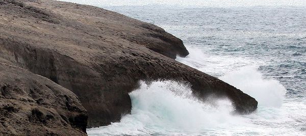 Waves Crashing on smooth rocks crop
