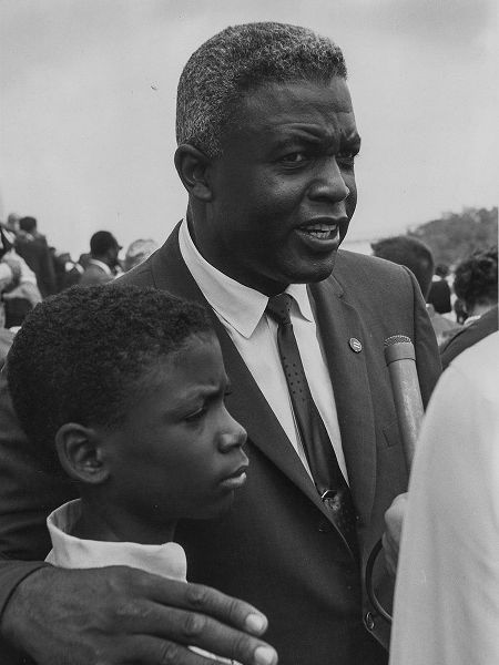 Former National Baseball League player-Jackie Robinson with his son