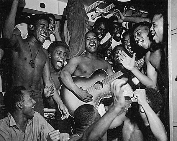 WWII men aboard the U.S.S. Ticonderoga hear the news of Japans surrender